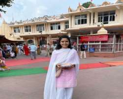 She is religious minded and often goes to temple to get blessings.